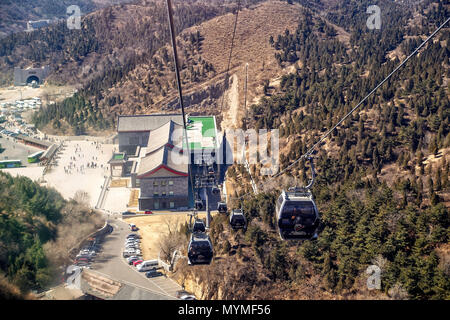 BADALING, CHINA - MARCH  13, 2016: Great Wall of China. A cable car taking visitors up to the Great Wall of China. Stock Photo