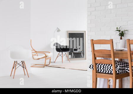 Modern, white interior with new design chairs in black and white, decorative, brick wall texture Stock Photo