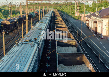 railroad cars at sunset, view from the top, with a reflection of the evening sun Stock Photo