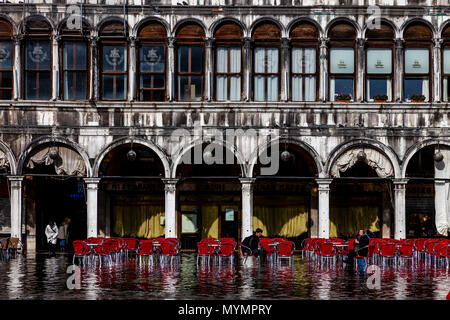 Acqua Alta (High Tide) In St Mark’s Square, Venice, Italy Stock Photo