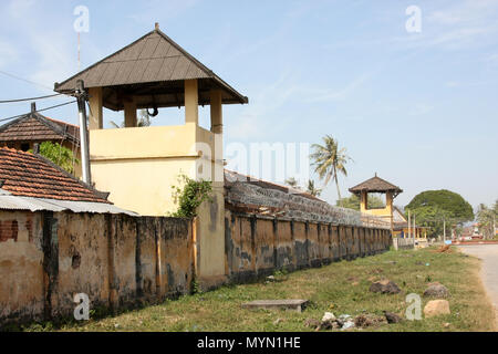 Old colonial gaol in Kampot, Cambodia. Despite its rundown apearance it is still in use today, Jan 2012. An old wheel rim is used as an alarm bell. Stock Photo