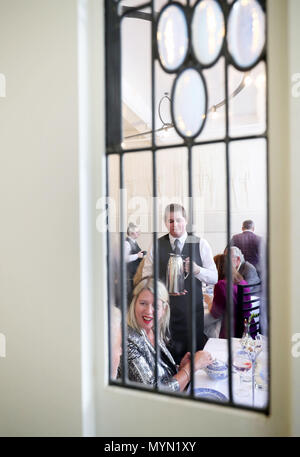 Guests preview the upgraded restaurant, Mackintosh at the Willow, at the original Willow Tea Rooms building in Glasgow, on the 150th anniversary of the birth of designer Charles Rennie Mackintosh, after &Acirc;£10 million restoration project. Stock Photo