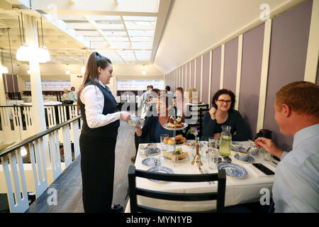 Guests preview the upgraded restaurant, Mackintosh at the Willow, at the original Willow Tea Rooms building in Glasgow, on the 150th anniversary of the birth of designer Charles Rennie Mackintosh, after &Acirc;£10 million restoration project. Stock Photo