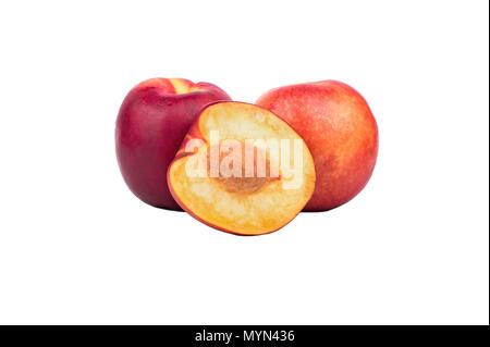 Two fresh nectarines with half a fruit on a white background Stock Photo
