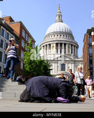 woman begging, St Paul's Cathedral, City of London, London, England, UK Stock Photo