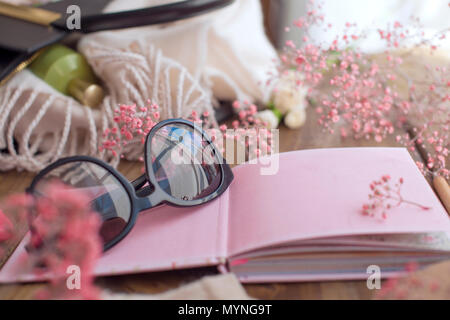 Sunglasses and a pink notebook with clean sheets. Planning. Copy space Stock Photo