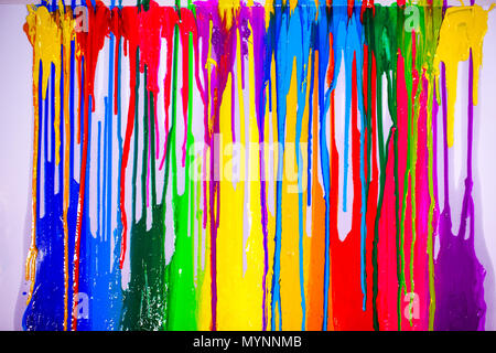 colorful of plastisol ink are dripping by in opposite directions Stock Photo