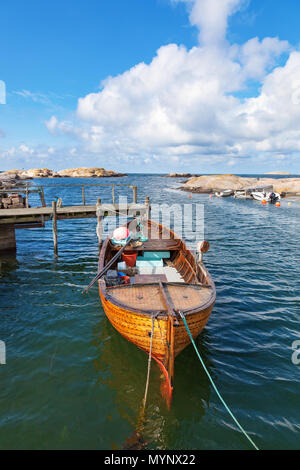 Wood Fishing Boat is Moored on the Beach Stock Photo - Alamy