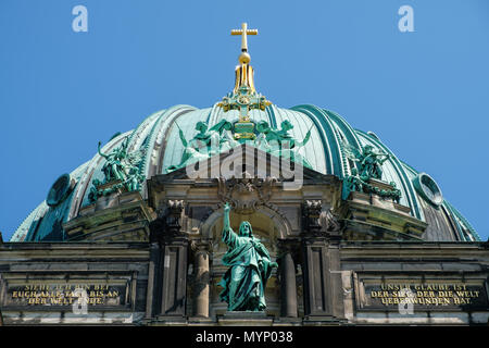 Berlin, Germany - june 2018:  Jesus Christ statue on top of the dome of the Berlin cathedral  in Berlin, Germany Stock Photo