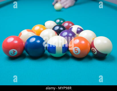 Breaking the balls at a pool game Stock Photo