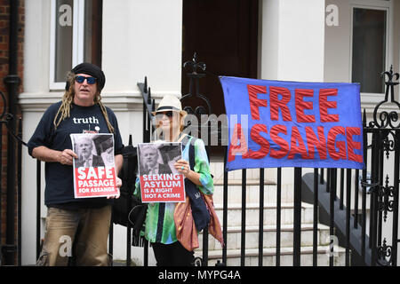 Supporters of Julian Assange outside the Ecuadorian Embassy in London as representatives from the Australian High Commission has visited the WikiLeaks founder. Stock Photo