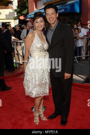 Russell Wong  and wife  -  Mummy - Tomb Of The Dragon Emperor  Premiere at the Gibson Amphitheatre Theatre In Los Angeles.  full length eye contact smile 07 WongRussell wife 07  Event in Hollywood Life - California, Red Carpet Event, USA, Film Industry, Celebrities, Photography, Bestof, Arts Culture and Entertainment, Celebrities fashion, Best of, Hollywood Life, Event in Hollywood Life - California, Red Carpet and backstage, Music celebrities, Topix, Couple, family ( husband and wife ) and kids- Children, brothers and sisters inquiry tsuni@Gamma-USA.com, Credit Tsuni / USA, 2006 to 2009 Stock Photo