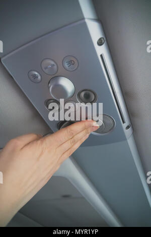 Woman checking air-conditioning system in bus. Stock Photo