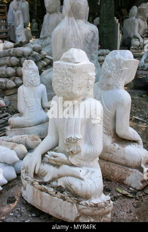 Unfinished statues at the workshop near Mahamuni Pagoda in Mandalay, Myanmar. Mahamuni Pagoda is a Buddhist temple and major pilgrimage site in Myanma Stock Photo