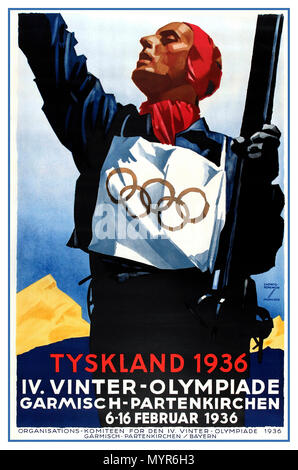 1936 vintage Winter Olympics sport poster in Danish: Tyskland 1936 (Nazi Germany / The Third Reich / Germany 1936) IV Winter Olympiade (Winter Olympics) Garmisch-Partenkirchen 6-16 February 1936. image depicting a skier with bib featuring the Olympic rings symbol, celebrating victory with mountain in background. Poster artwork by Ludwig Hohlwein (1874-1949). Published by the Reichsbahn Centrale for German Travel Agents  Berlin Germany Stock Photo