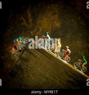 File of miniature cyclists in plastic, studio shot Stock Photo