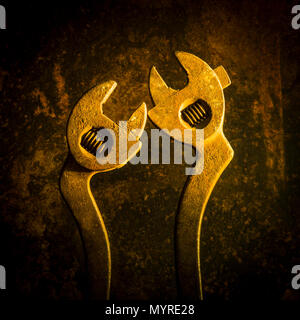 Two rusted wrenches head to tail, studio shot Stock Photo