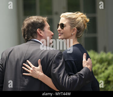 Washington, District of Columbia, USA. 7th June, 2018. Ambassador to Japan William Hagerty and presidential advisor Ivanka Trump(Right) greet each other before the start of a news briefing with Presidential United States President Donald J. Trump and Japanese Prime Minister Shinzo Abe at the White House in Washington, DC, June 7, 2018. Credit: Chris Kleponis/CNP Credit: Chris Kleponis/CNP/ZUMA Wire/Alamy Live News Stock Photo