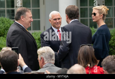 United States Secretary of State Mike Pompeo(L), Vice President Mike Pence(2nd Left), Ambassador to Japan William Hagerty(2nd Right) and presidential advisor Ivanka Trump(Right) chat before the start of a news briefing with Presidential United States President Donald J. Trump and Japanese Prime Minister Shinzo Abe at the White House in Washington, DC, June 7, 2018. Credit: Chris Kleponis/CNP /MediaPunch Stock Photo