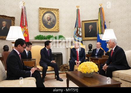 Washington DC, USA. 7th June, 2018. U.S. President Donald Trump, center, during a bilateral meeting with Japanese Prime Minister Shinzo Abe, left, in the Oval Office of the White House June 7, 2018 in Washington, DC. Abe met to discussions on the upcoming summit with North Korea and the G7 Summit. Credit: Planetpix/Alamy Live News Stock Photo