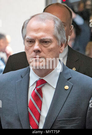 In this file photo from Thursday, June 8, 2017, James A. Wolfe, 58, the former director of security for the Senate Intelligence Committee, as he walks with former FBI Director James Comey as Comey departs after testifying in a closed hearing on the Russian intervention in the 2016 Presidential election before the United States Senate Select Committee on Intelligence on Capitol Hill in Washington, DC. Wolfe was indicted on June 7, 2018 for lying to the FBI about repeated contacts with three reporters and passing classified information from the committee to two of them. Credit: Ron Sachs/CNP Stock Photo