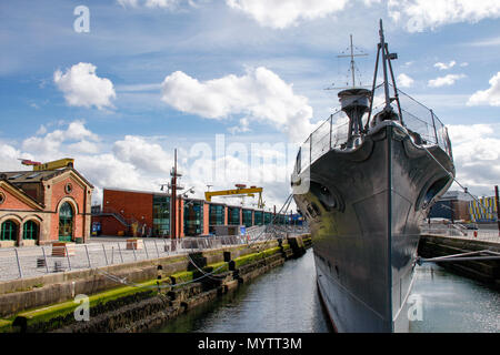 Bow view of HMS Caroline, a restored World War 1 battleship moored in Titanic Quarter, Belfast and the last survivor of the Battle of Jutland Stock Photo