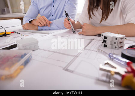 Two Architect Working With Work Tools Over Blueprint Stock Photo