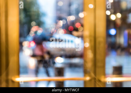 Grand central terminal entrance from Lexington Avenue in New York City NYC, rainy day or evening, looking outside through door window blurred abstract Stock Photo