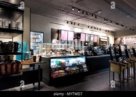 New York City, USA - October 30, 2017: Inside Starbucks store in midtown Manhattan NYC NY with menu, order counter selection of food, coffee in cafe Stock Photo