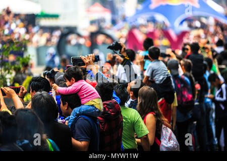 Mexico City, Mexico - June 27, 2015: Audience taking pictures and video of the event, at the Infiniti Red Bull Racing F1 Showrun. Stock Photo
