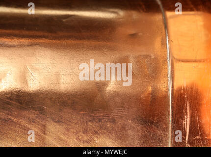 Scratched texture copper plating background close-up Stock Photo