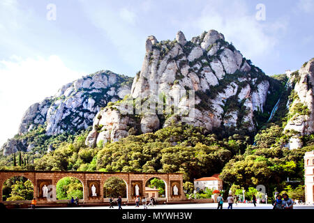 May 24, 2016- Montserrat, Spain- Montserrat mountains with brick archways with statues Stock Photo
