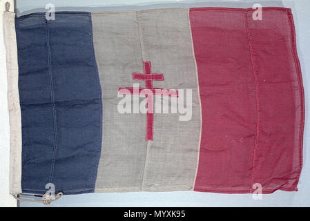 .  English: Free French flag A wool bunting flag with a cotton hoist, machine sewn and with a rope attached. It is divided into three vertical stripes, blue, white and red with the red cross of Lorraine on the white stripe. 'FF' is marked in ink on the hoist. The flag was used by the French forces in opposition to the German occupation, led in exile by General Charles de Gaulle (1890-1970). The cross of Lorraine was added to the French tricolour to distinguish it from the French national flag still in use by the Vichy government - in effect a German puppet state. unavailable  . 1939-44. Unknow Stock Photo