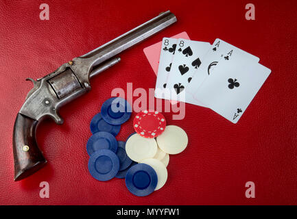 Dead mans hand aces and eights with Wild Bill's six shooter. Stock Photo