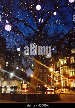 Mayfair, London, UK. 10th Dec, 2014. Christmas lights light up the trees in Mayfair, London. Credit:  Katie Collins / StockimoNews/Alamy Live News Stock Photo