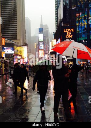 Manhattan, New York, USA. January 3, 2015. Times Square is a colorful sea of lights and holiday tourists visitors in rainy NYC. Stock Photo