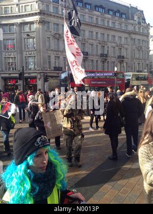 London, UK. 17th Jan, 2015. Protestors march down Oxford Street, London to raise awareness of the 20,000 whales, dolphins and porpoises slaughtered every year in Taiji, Japan. Credit:  Chris Pringle and Rebecca Andrews/StockimoNews/Alamy Live News Stock Photo