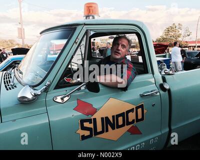 Bellmore, New York, USA. 22nd May, 2015. An owner sits in his green 1969 Chevy Pick Up C/10 with SUNOCO emblem on its door, one of hundreds of Classic cars at the weekly Bellmore Friday Night Car Show at the Long Island Railroad parking lot. Credit:  aparry/StockimoNews/Alamy Live News Stock Photo
