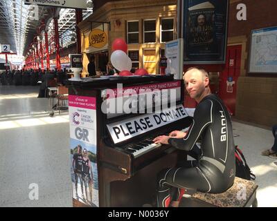 London, UK. 11th June, 2015. Norman Cambridge playing piano for 12 hours in Marylebone railway station on the 11th of June 2015 on behalf of Cancer research before doing the Iron Man  triathlon in Stafford on June 14th 2015 Credit:  Adam Tiernan Thomas/StockimoNews/Alamy Live News Stock Photo