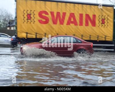 London Rd, Aylesford, Kent, UK. 11th Jan, 2016. A Volvo car splashes through deep flood water on the A20 at Aylesford, near Maidstone in Kent, UK Credit:  Matthew Richardson/StockimoNews/Alamy Live News Stock Photo