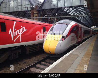 London, UK. 18th March, 2016. New IEP Virgin Train 800101 in Virgin colours at London Kings Cross. Due into service 2018. Credit:  Rob Ford / StockimoNews/Alamy Live News Stock Photo