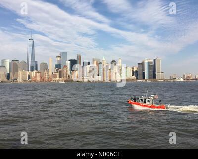 Morris St, Jersey City, New Jersey, USA. 23rd Mar, 2016. A U.S. Coast Guard boat equipped with machine gun patrols the waters of New York Harbor following the terror attacks in Brussels Credit:  Robert Quinlan/StockimoNews/Alamy Live News Stock Photo