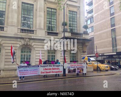 Curzon St, London, UK. 11th May, 2016. Protest outside Saudi Arabia Embassy in Mayfair, London with gold plated Rolls-Royce in background Credit:  William Barton/StockimoNews/Alamy Live News Stock Photo