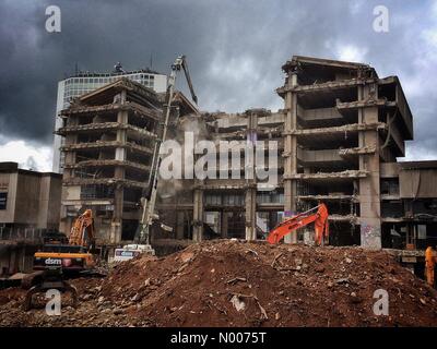 Birmingham, West Midlands, UK. 18th May, 2016. Paradise Lost. A giant wrecking machine pulls down the old Central Library in Birmingham's Paradise area. 18 May 2016. Birmingham UK.  Redevelopment is being done by the Argent Group. Credit:  Richard Sheppard/StockimoNews/Alamy Live News Stock Photo