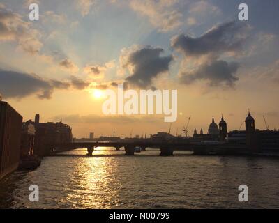 London, UK. 28th May, 2016. The sun begins to set over the river Thames in London after a beautiful early summers day Credit:  Patricia Phillips/StockimoNews/Alamy Live News Stock Photo