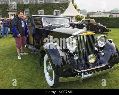 Sussex, UK. 23rd June, 2016. Goodwood festival is speed 1 st day moving motor show. As the weather clears up the public come in and view the vehicles. These two men can be seen looking at this 1936 Rolls Royce Phantom III. Credit:  Photovision Images / StockimoNews/Alamy Live News Stock Photo