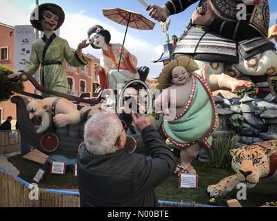 Dénia, Alicante, Spain. 17th Mar, 2017. Fallas in Denia, Spain. A tourist takes a photo of one of the large Fallas monuments in the town. The Fallas monuments will be burnt on the last day of the fiesta. Credit: Scott Ramsey/StockimoNews/Alamy Live News Stock Photo