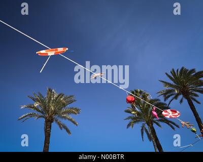 Dénia, Alicante, Spain. 17th Mar, 2017. Fallas in Denia, Spain. Home made bunting hangs across a courtyard in the town to celebrate Fallas. Credit: Scott Ramsey / StockimoNews/Alamy Live News Stock Photo