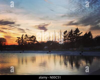 Godalming, UK. 26th Mar, 2017. UK Weather: Sunset over Godalming.  High pressure anticyclonic conditions over the Home Counties today. Sunset over Godalming in Surrey. Credit: jamesjagger/StockimoNews/Alamy Live News Stock Photo