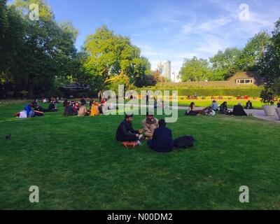 London, UK. 10th May, 2017. 10th of May, 2017. Spring has finally arrived and people are enjoying some sunshine in the green grass loan in the central London. Credit: Julija/StockimoNews/Alamy Live News Stock Photo